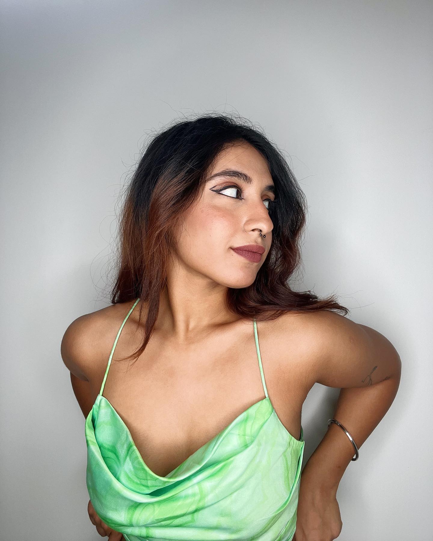 Priyanka Nazareth In Our Green Satin Cowl Set.